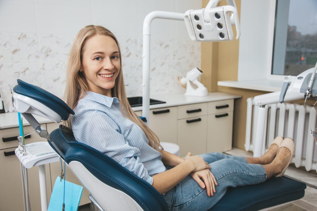 Patient at dentist chair in stomatologic clinic Office Tour Cosmetic Dental Associates